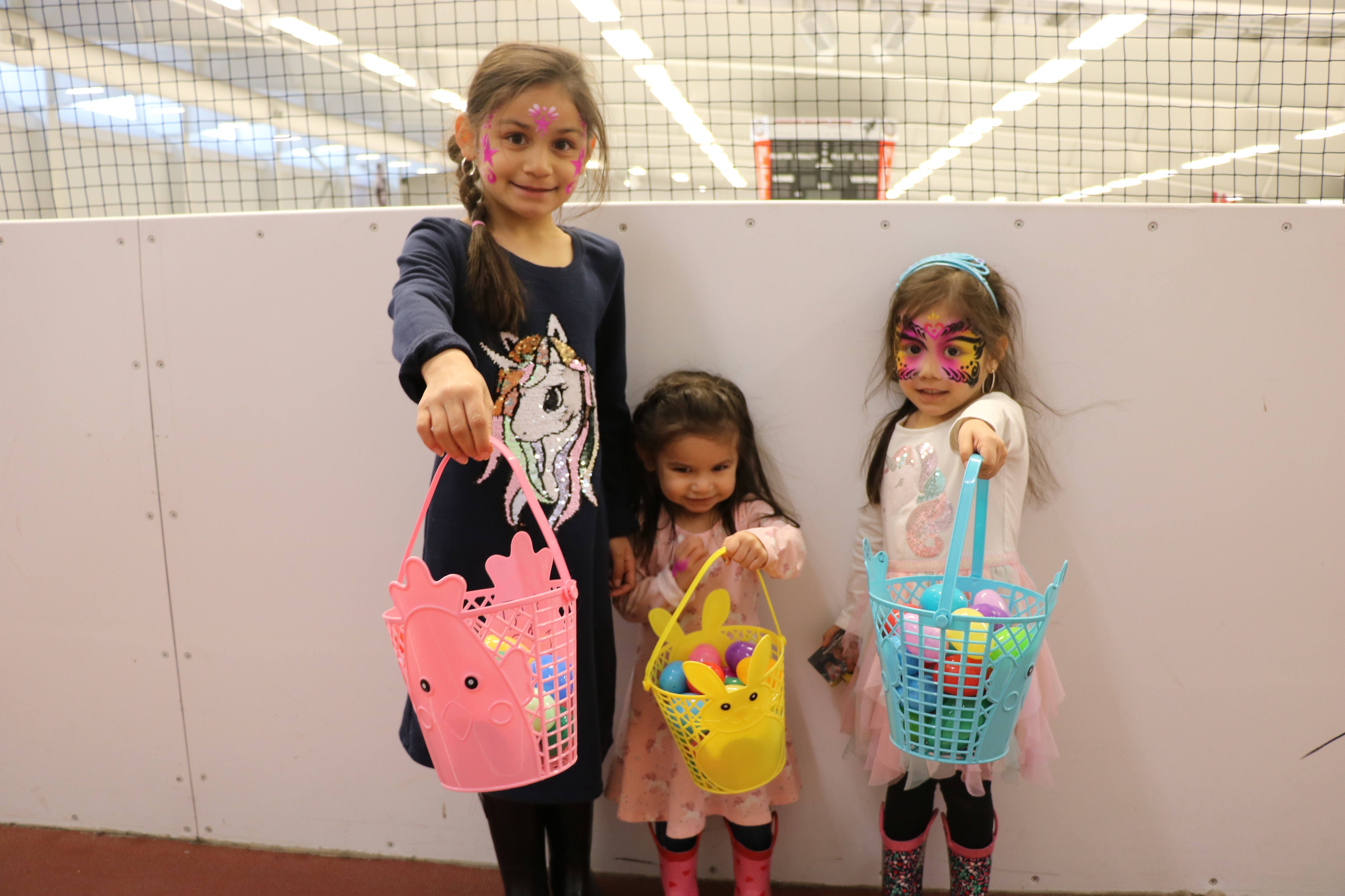 Girls holding Easter egg baskets